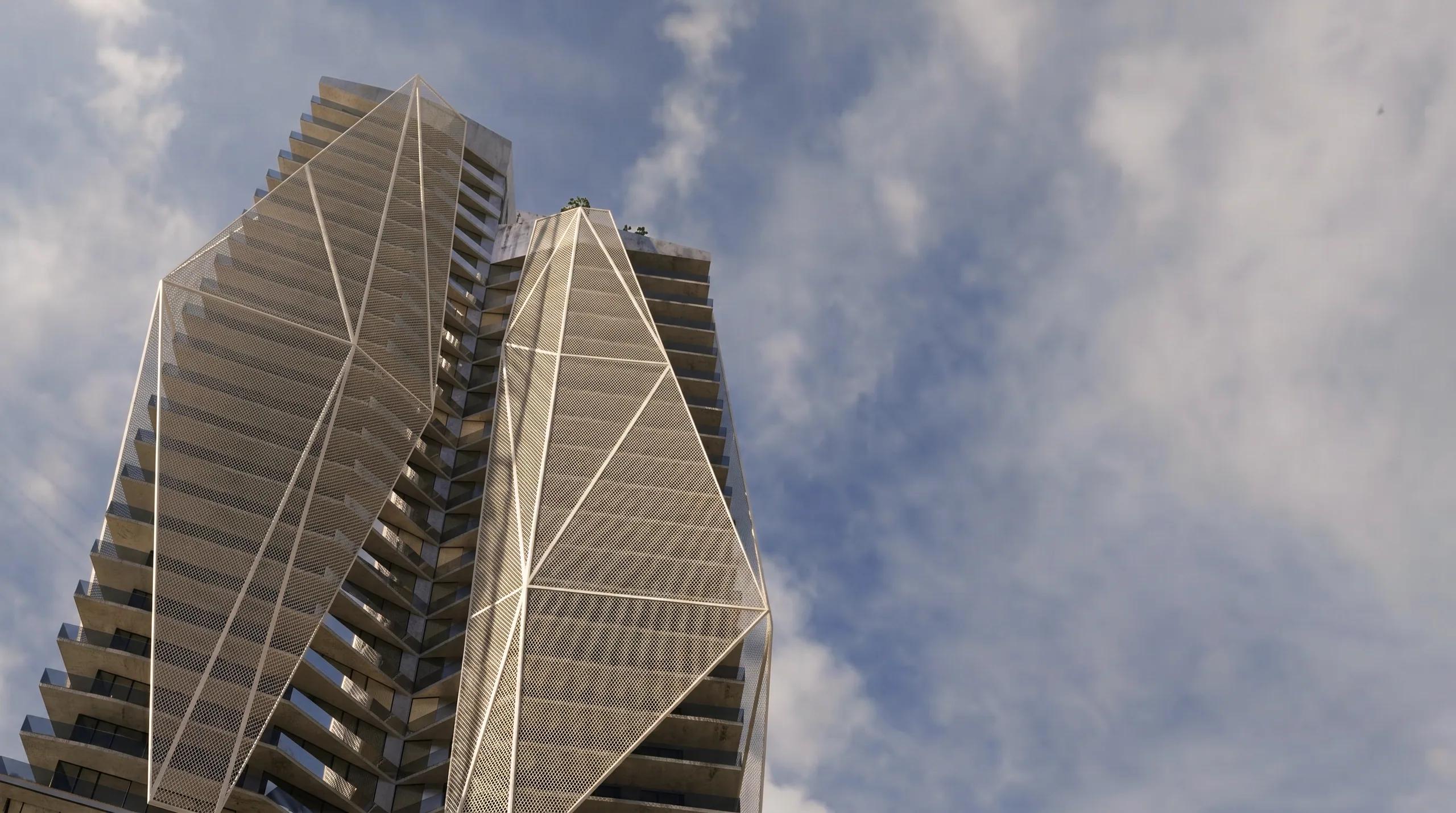 The paired towers viewed from below against moving cloud