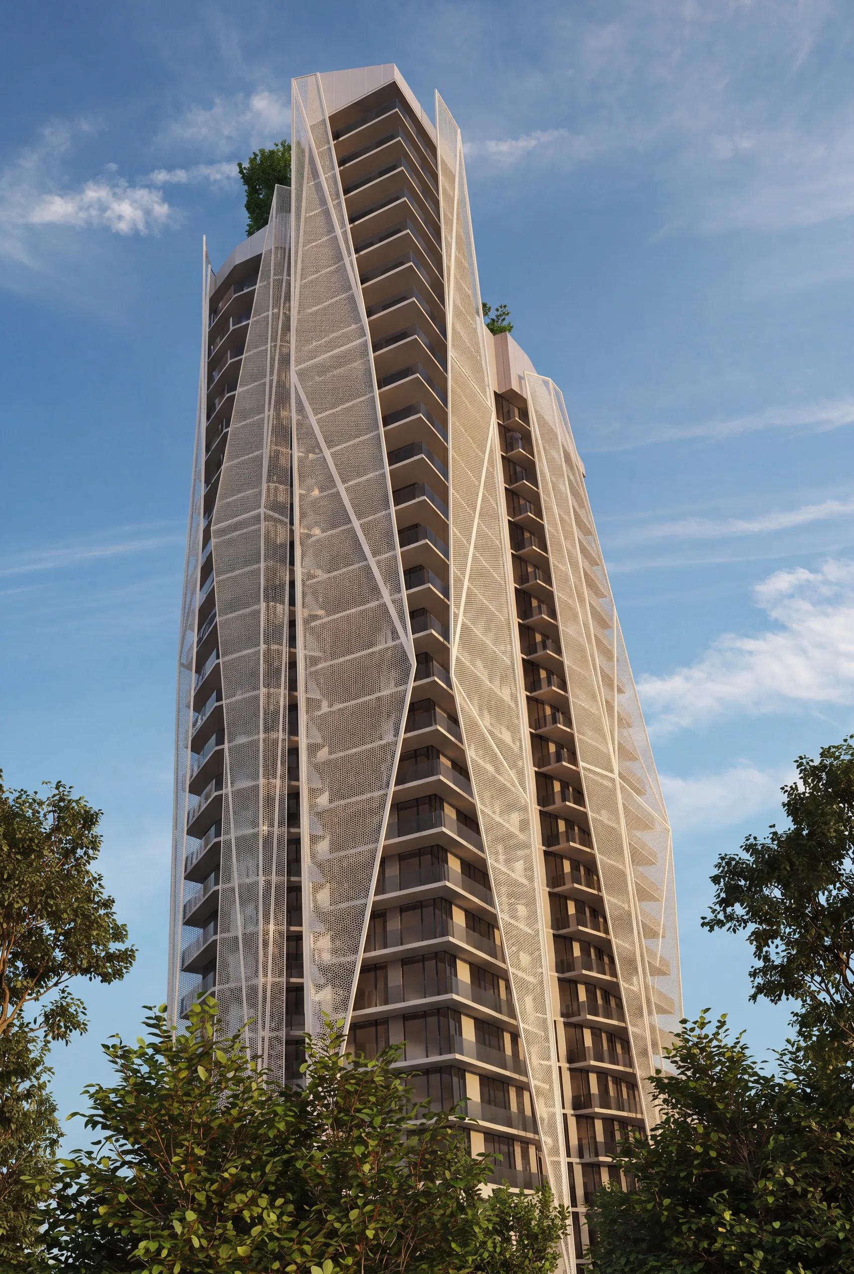 The tower framed by mature trees along the boulevard