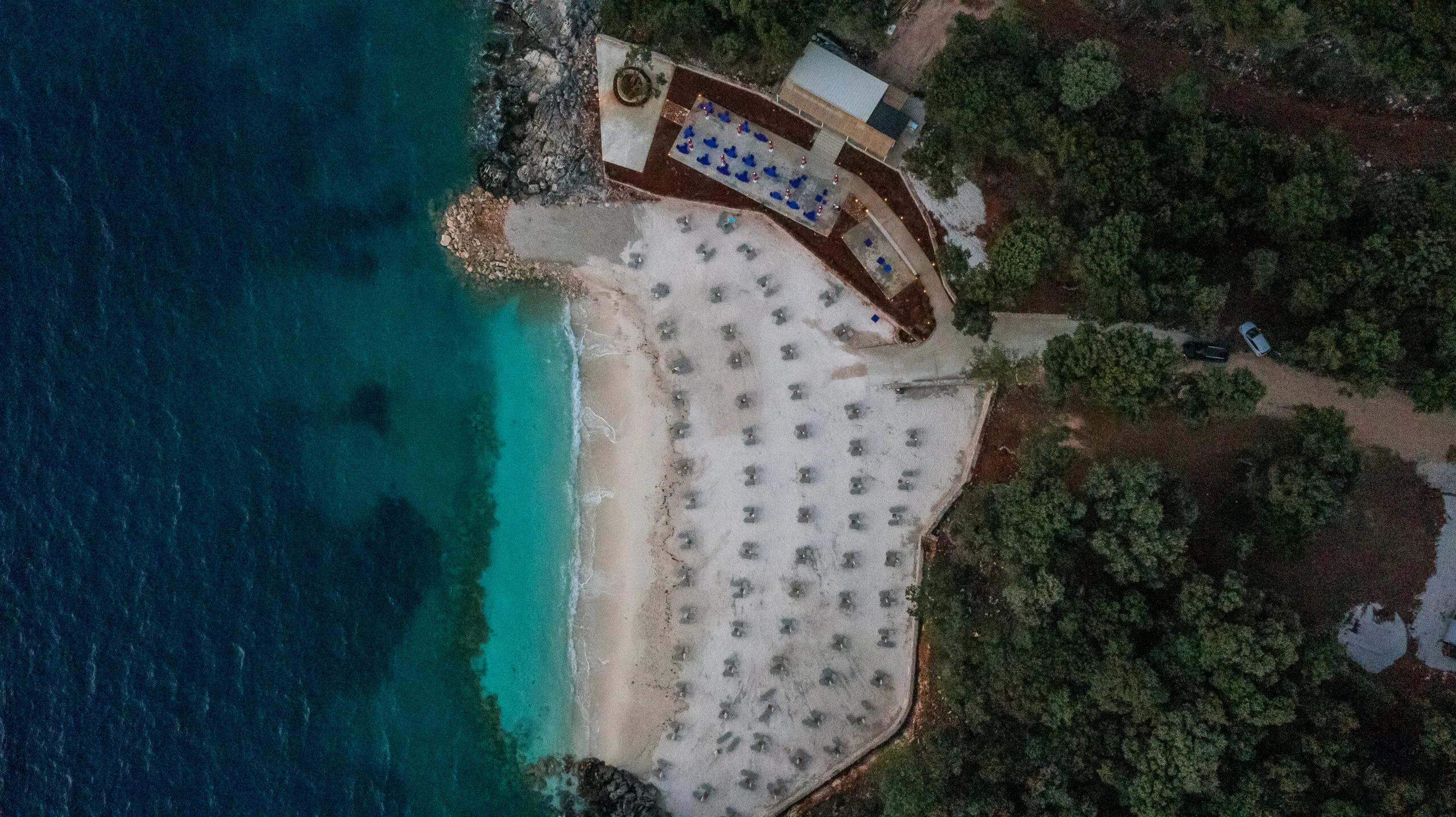 Looking straight down on the beach and its turquoise cove