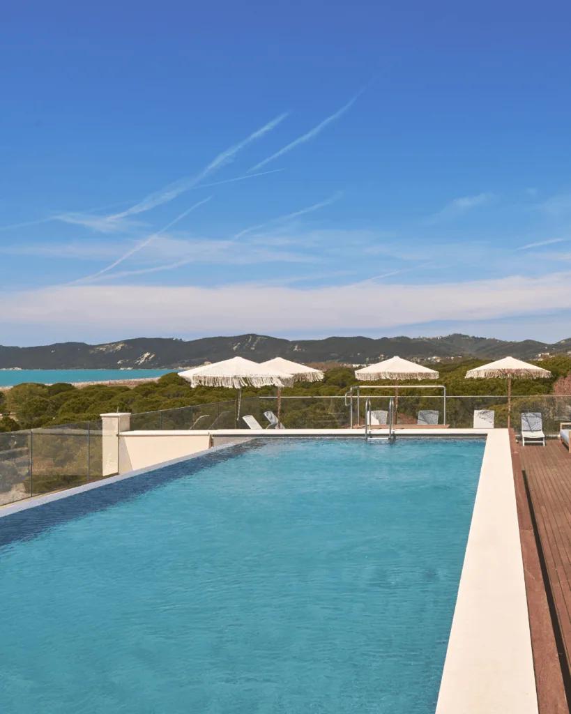 The infinity pool edge against the sea and sky