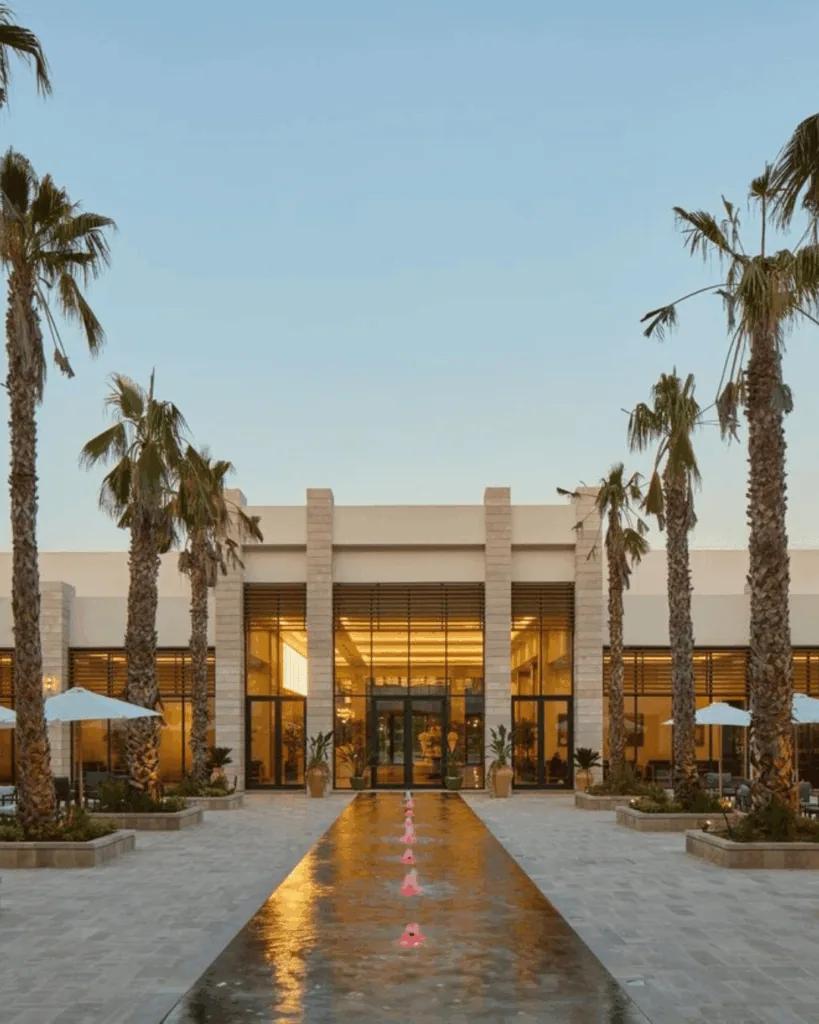The entrance colonnade lit at dusk