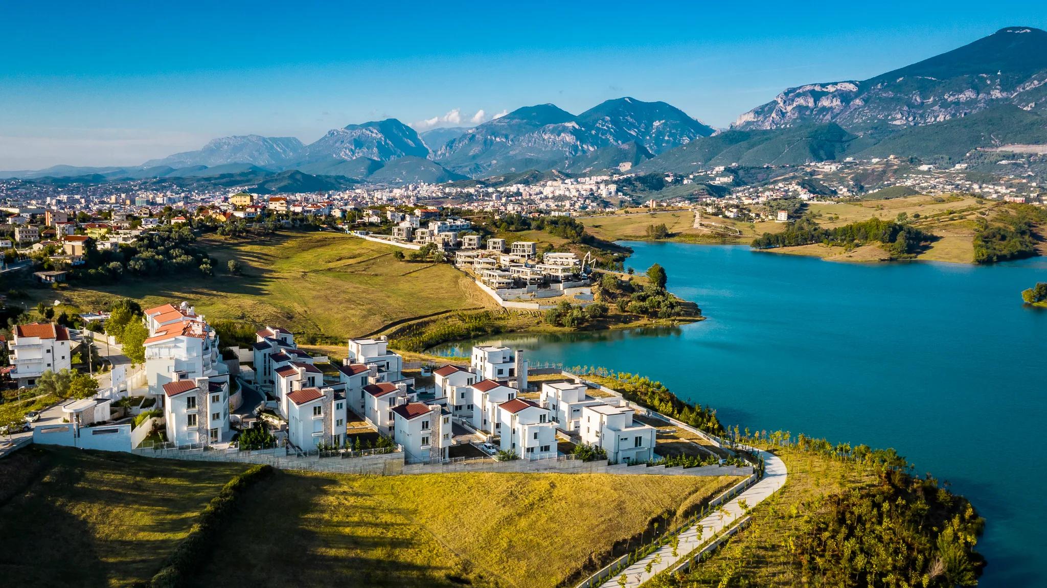 The development and the lake with the mountains beyond