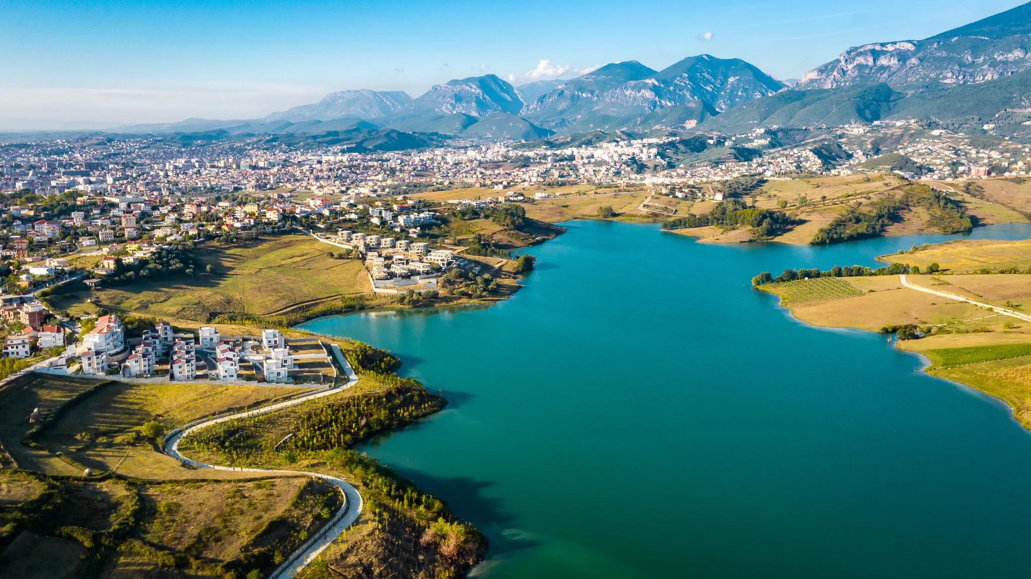 Wide aerial panorama of the lake and surrounding hills