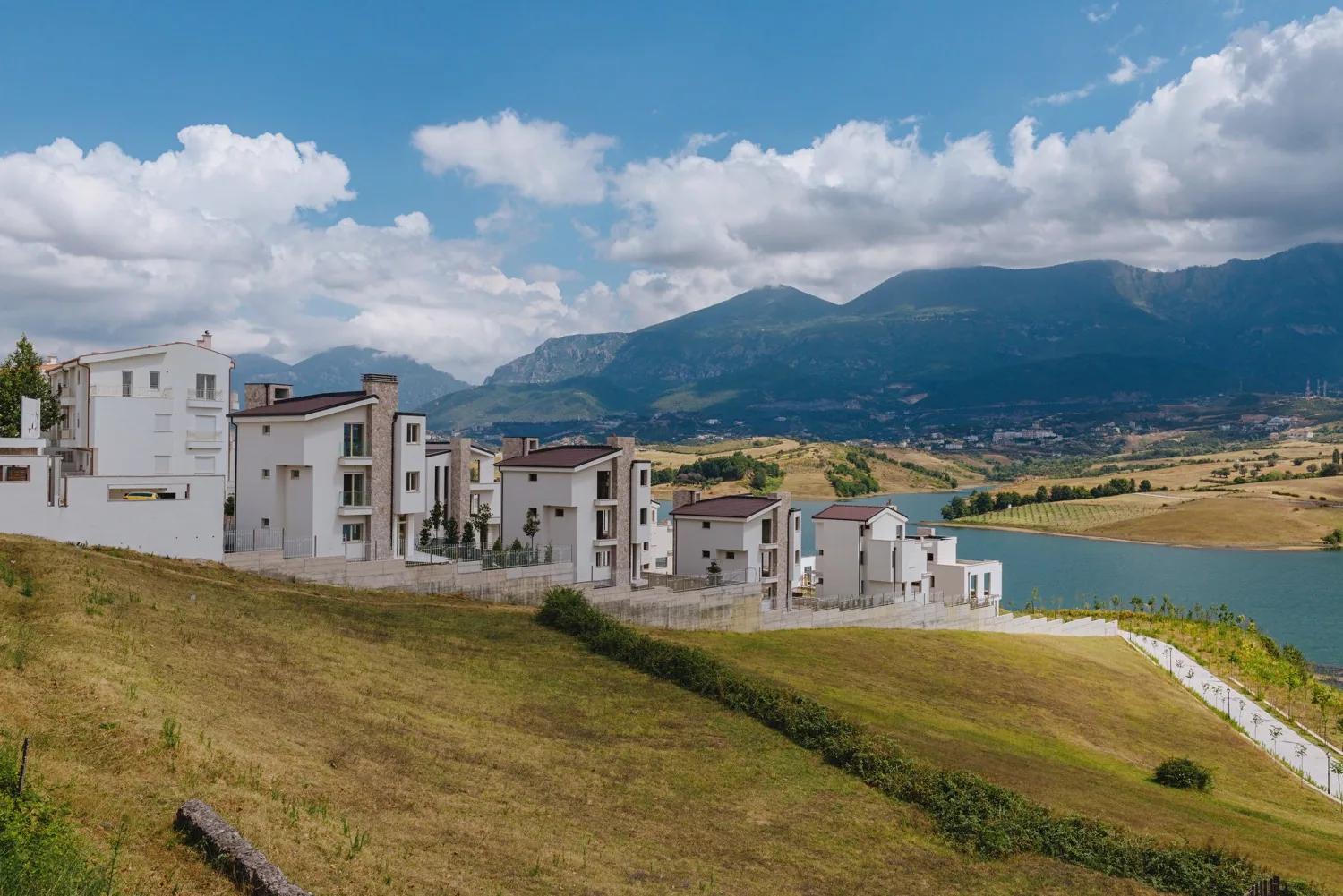 Ground-level view of the houses above the water