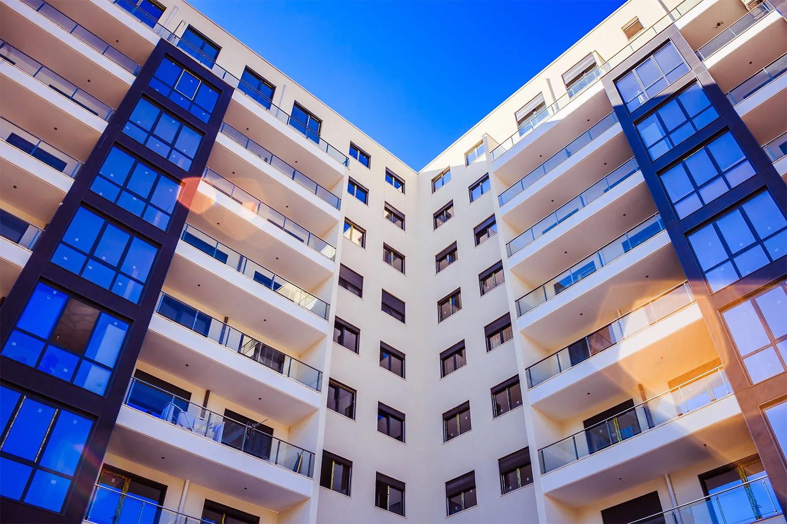 The glazed corner bays against an open sky