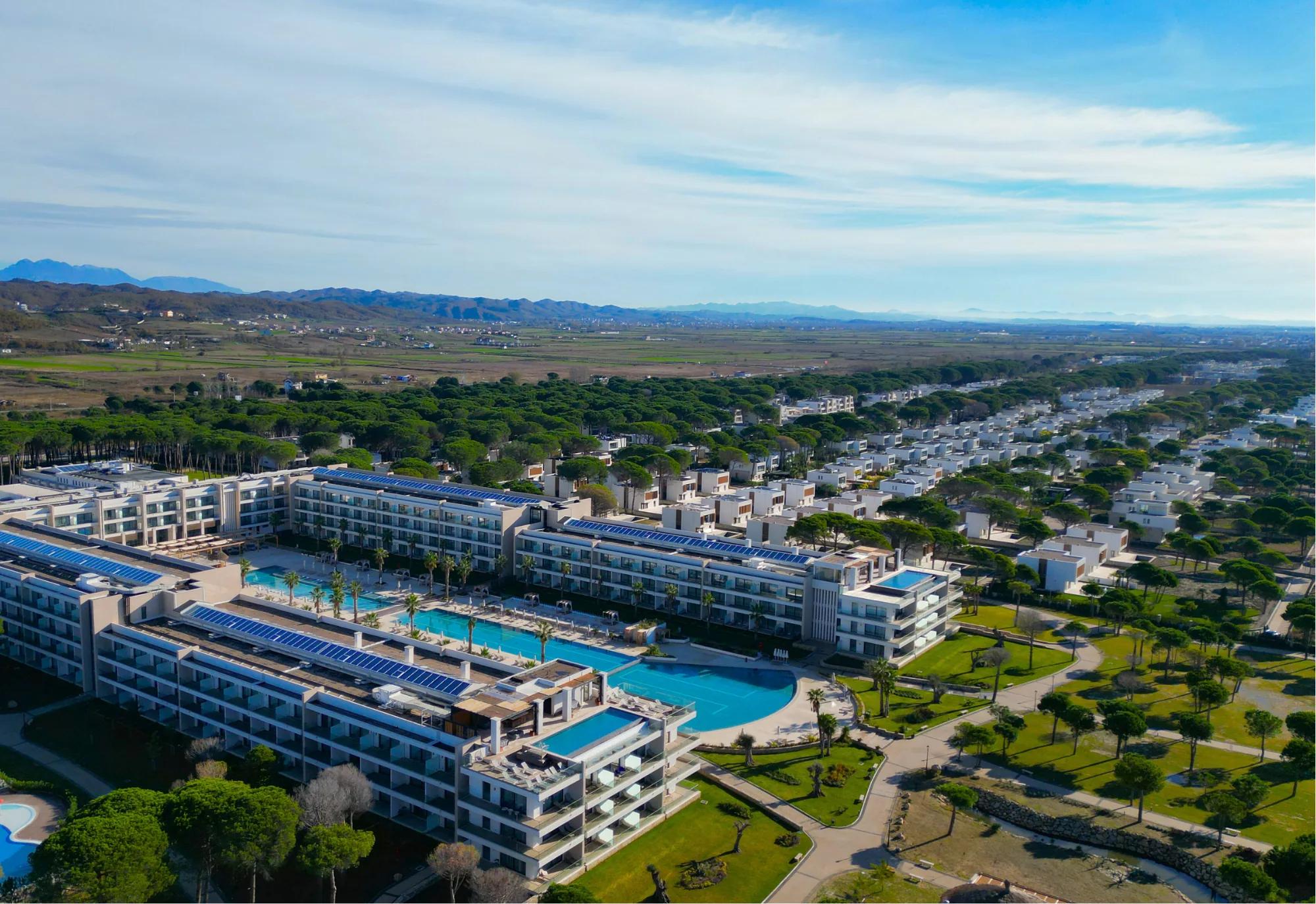 Aerial view of the Meliá Durrës hotel wings and pools within the resort