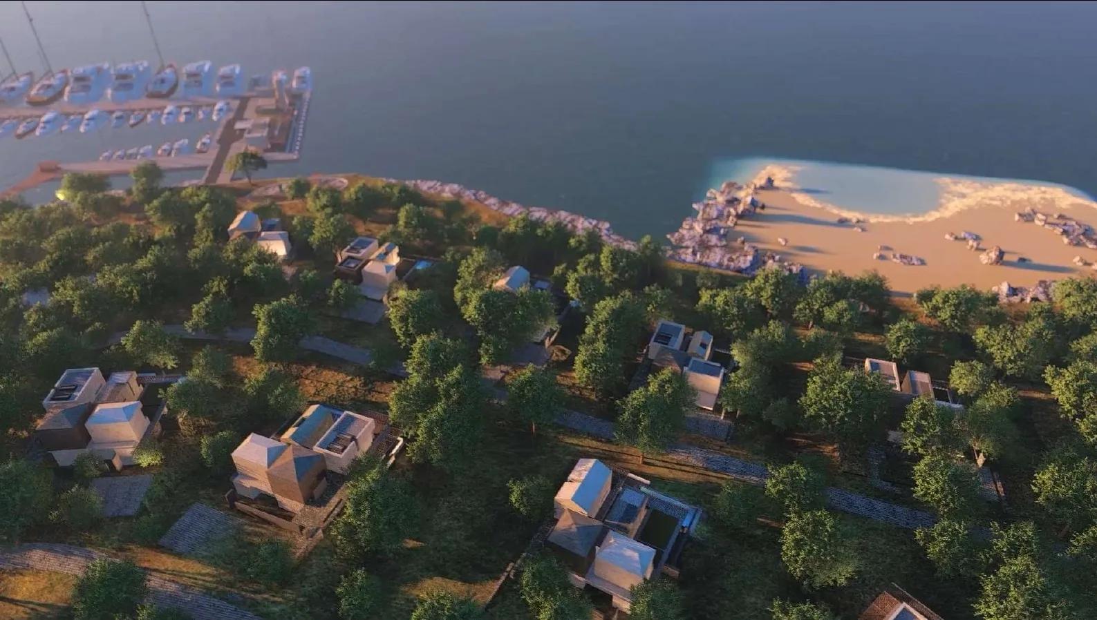 Aerial view across the bay to the beach and headland