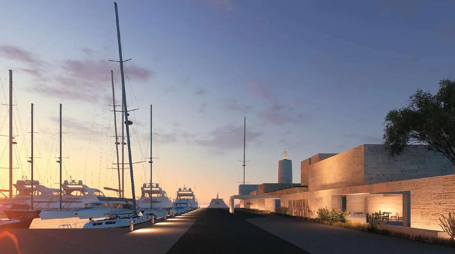 Yachts berthed along the quay at dusk