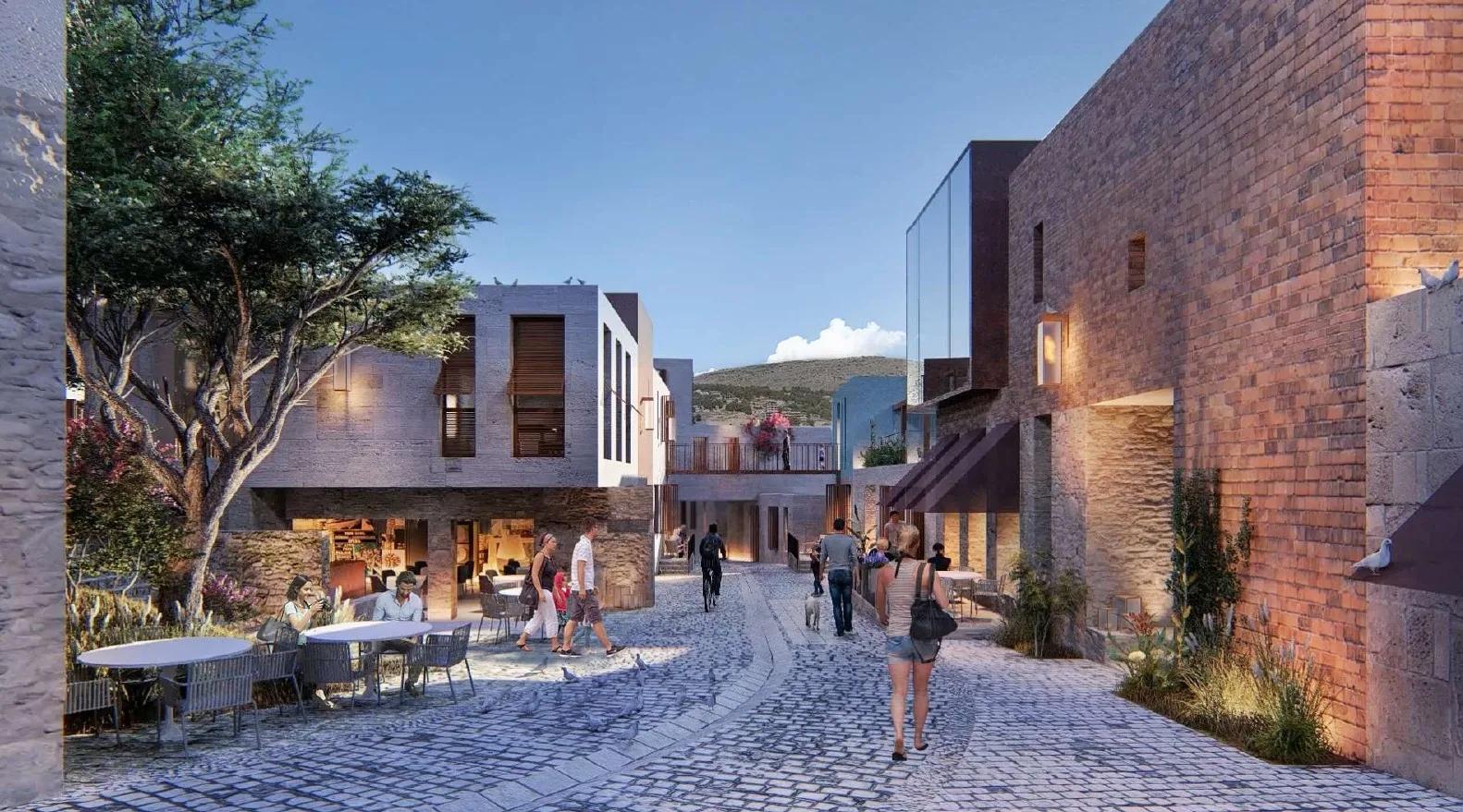 Stone-paved street lined with cafés and shops