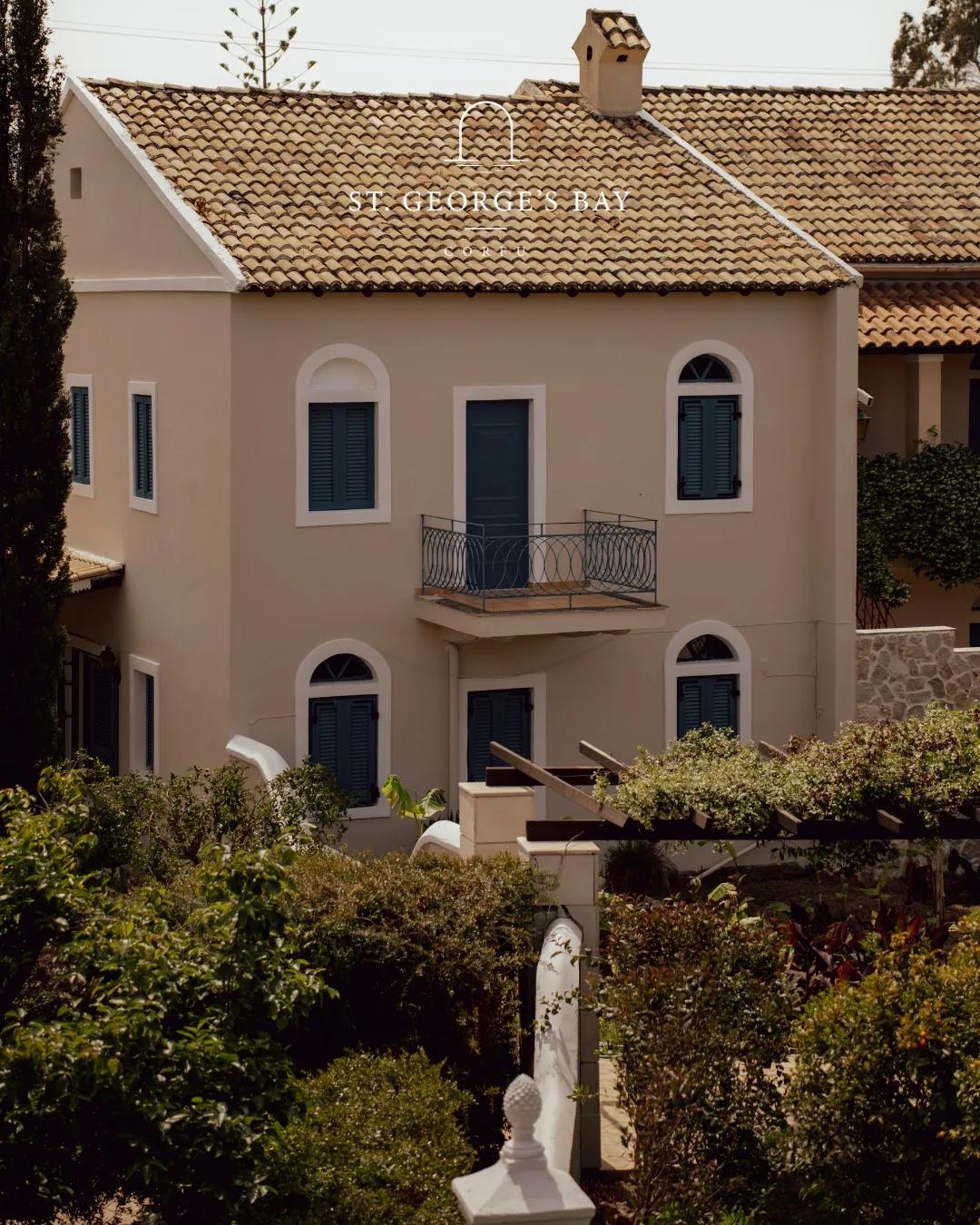 Villa facade with classical statuary in the foreground